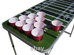 Table de Beer Pong sur un terrain de football avec trous de gobelets pré-percés.